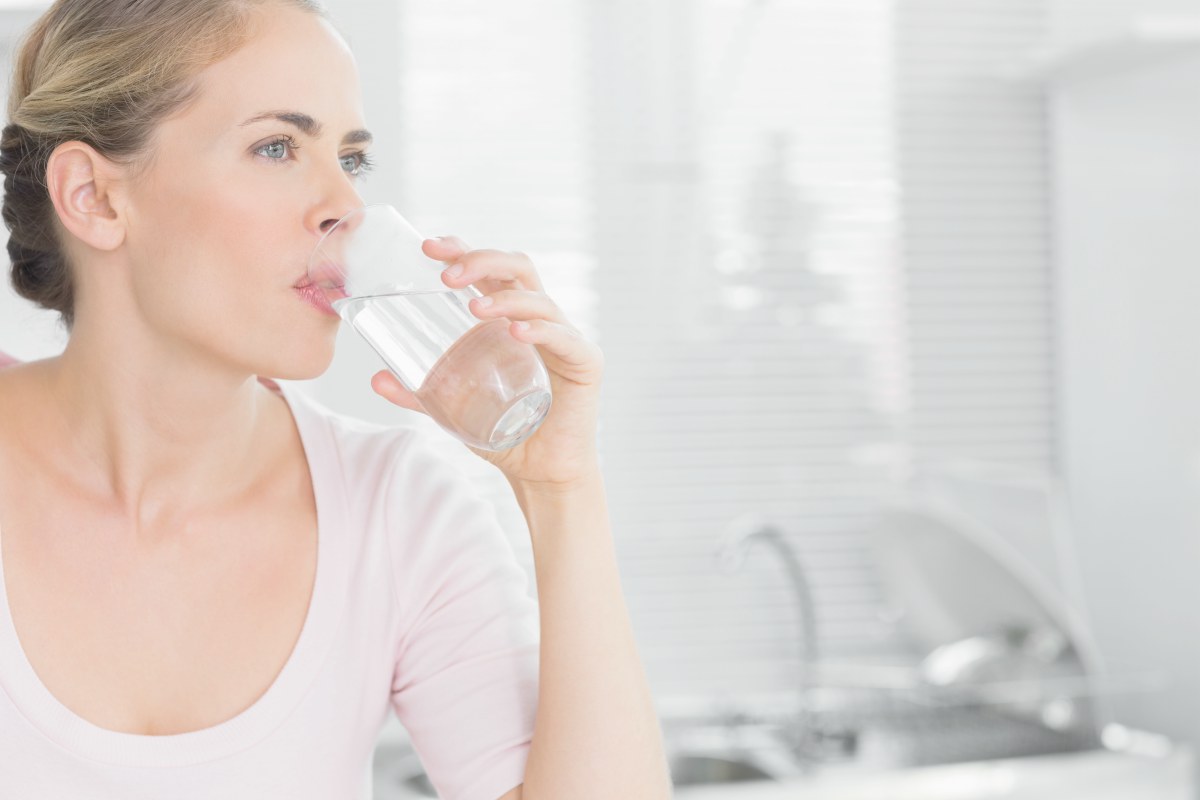 woman drinking water | Alkaline Water For Acid Reflux | what is acid reflux