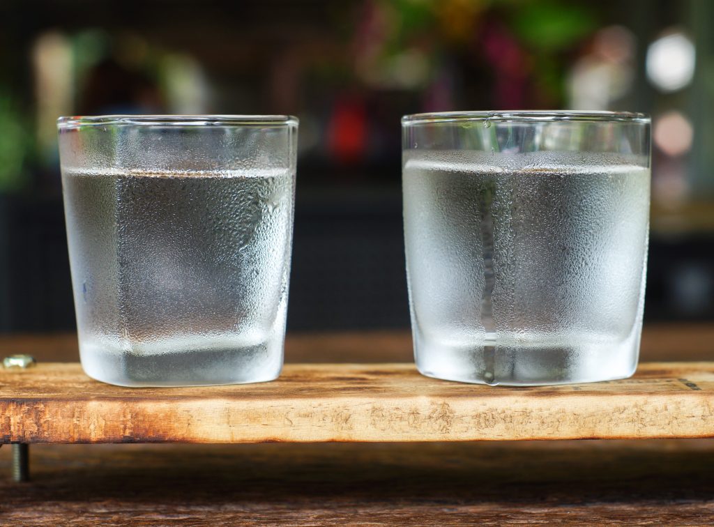 glasses of water on a wooden table