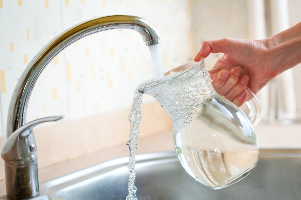 Filing glass pitcher with water