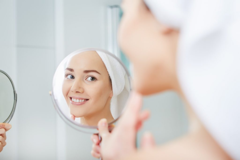 beautiful healthy woman and reflection in the mirror