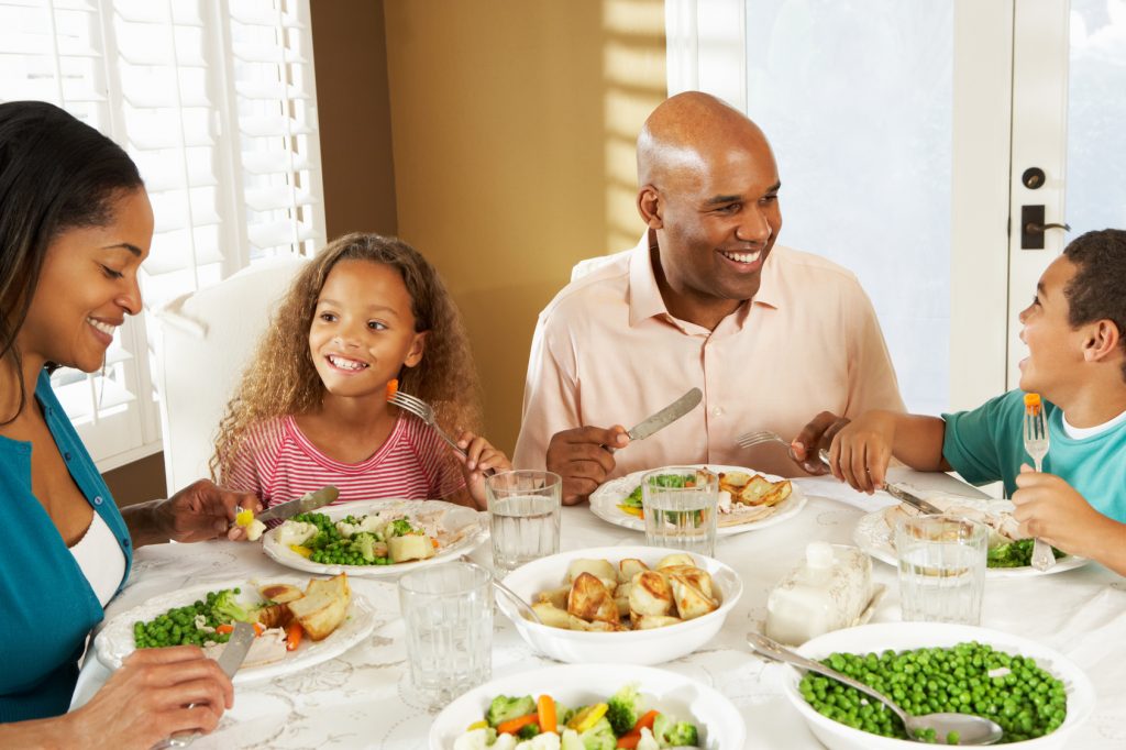 Family Enjoying Meal At Home