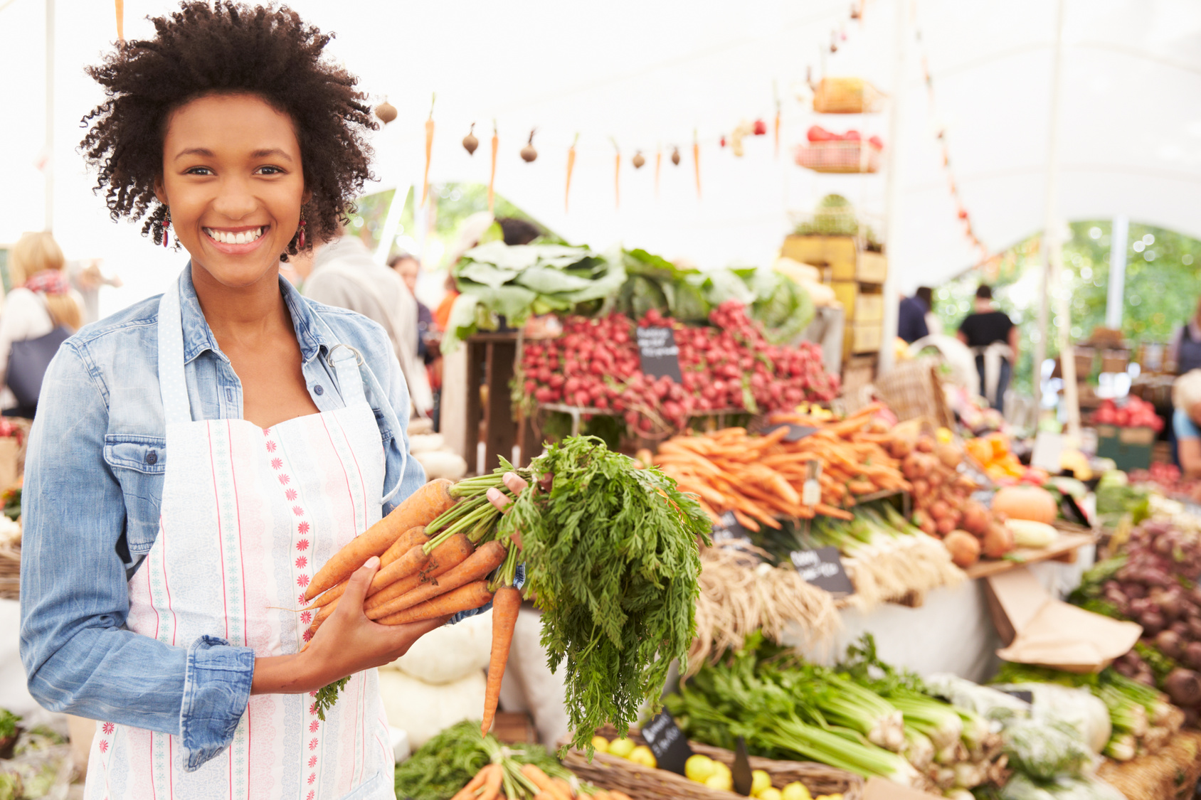 Female Stall Holder At Farmers Fresh Food Market