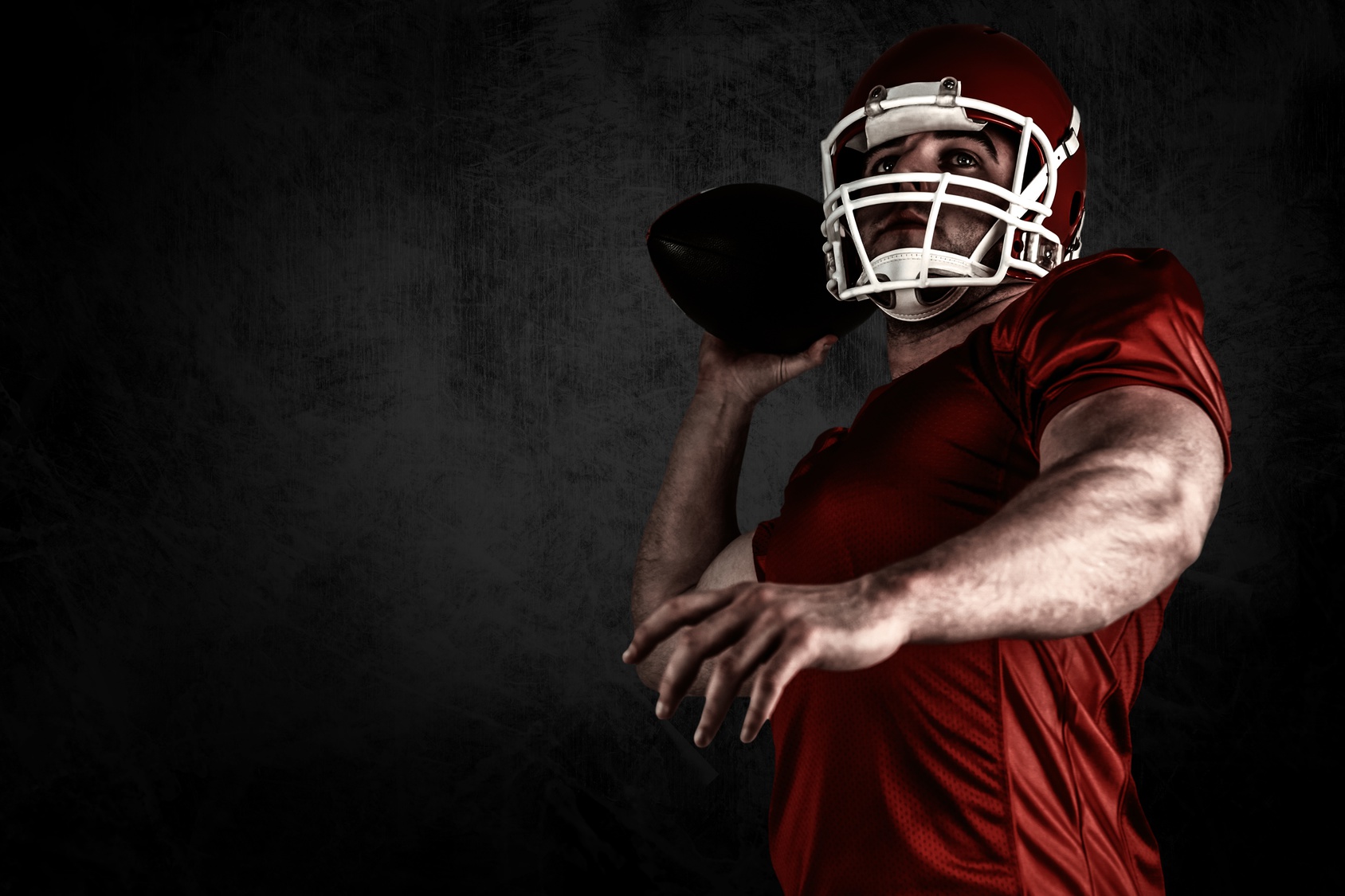 Composite image of american football player throwing ball