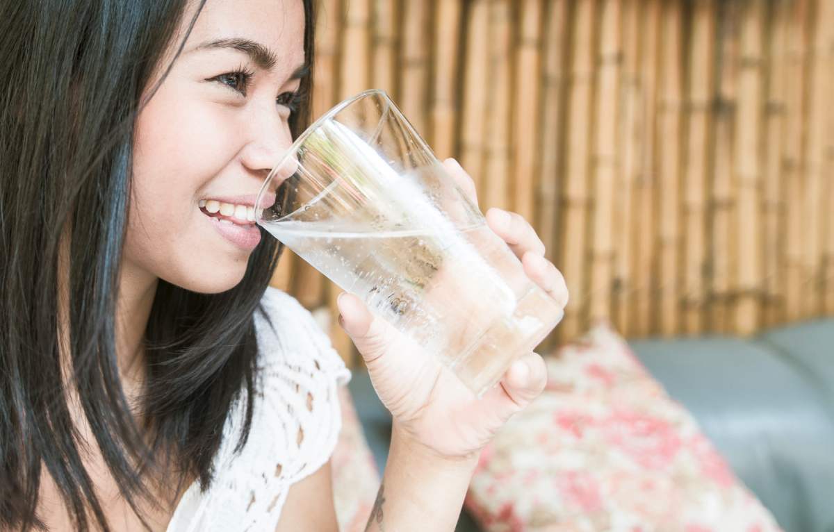 Asian woman holding a glass of water | Reasons to Love Tyent Water Ionizers, Part 9: Tyent Alkaline Water Is The Healthiest Water In The World. Dare To Compare!