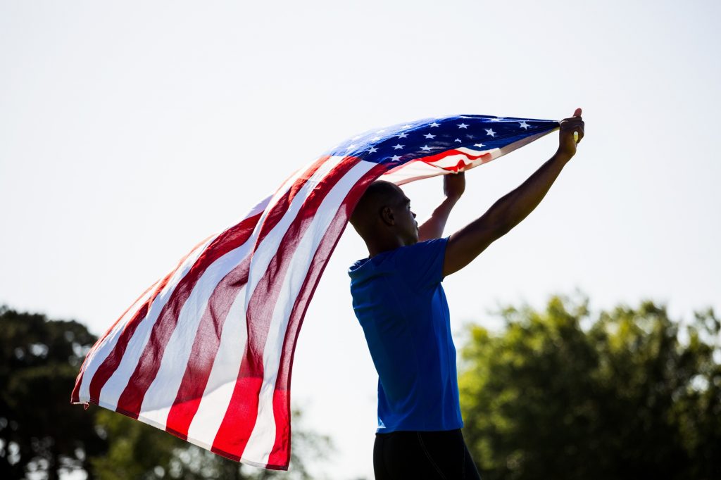 We have to hold the flag this high so that Michael Phelps doesn’t eat it.