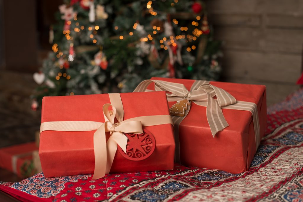 Boxes with gifts lying under the Christmas tree