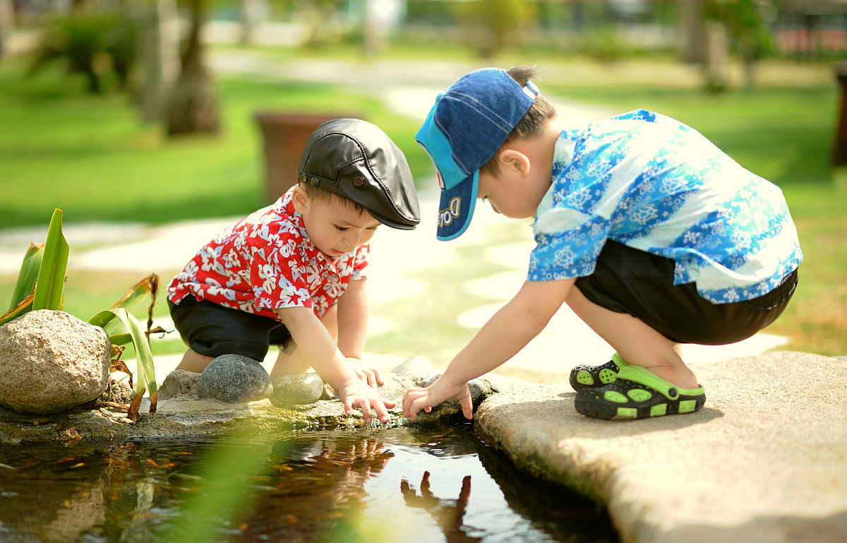 Boy in blue and white shirt playing near on body of water | How To Trick Your Kids Into Eating Healthy