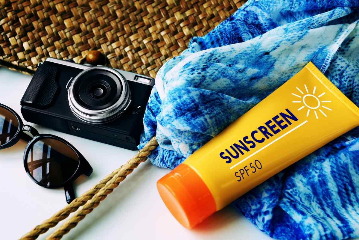 Packing beach camera sunscreen concept | Travel Essentials For A Healthy Holiday