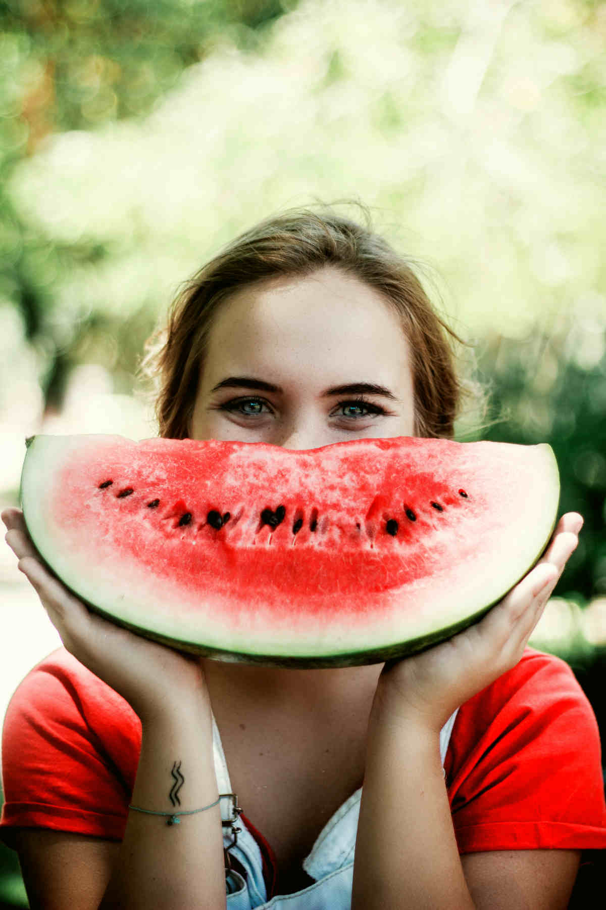 Woman holding sliced watermelon | Fruits and Veggies That Can Keep You Hydrated