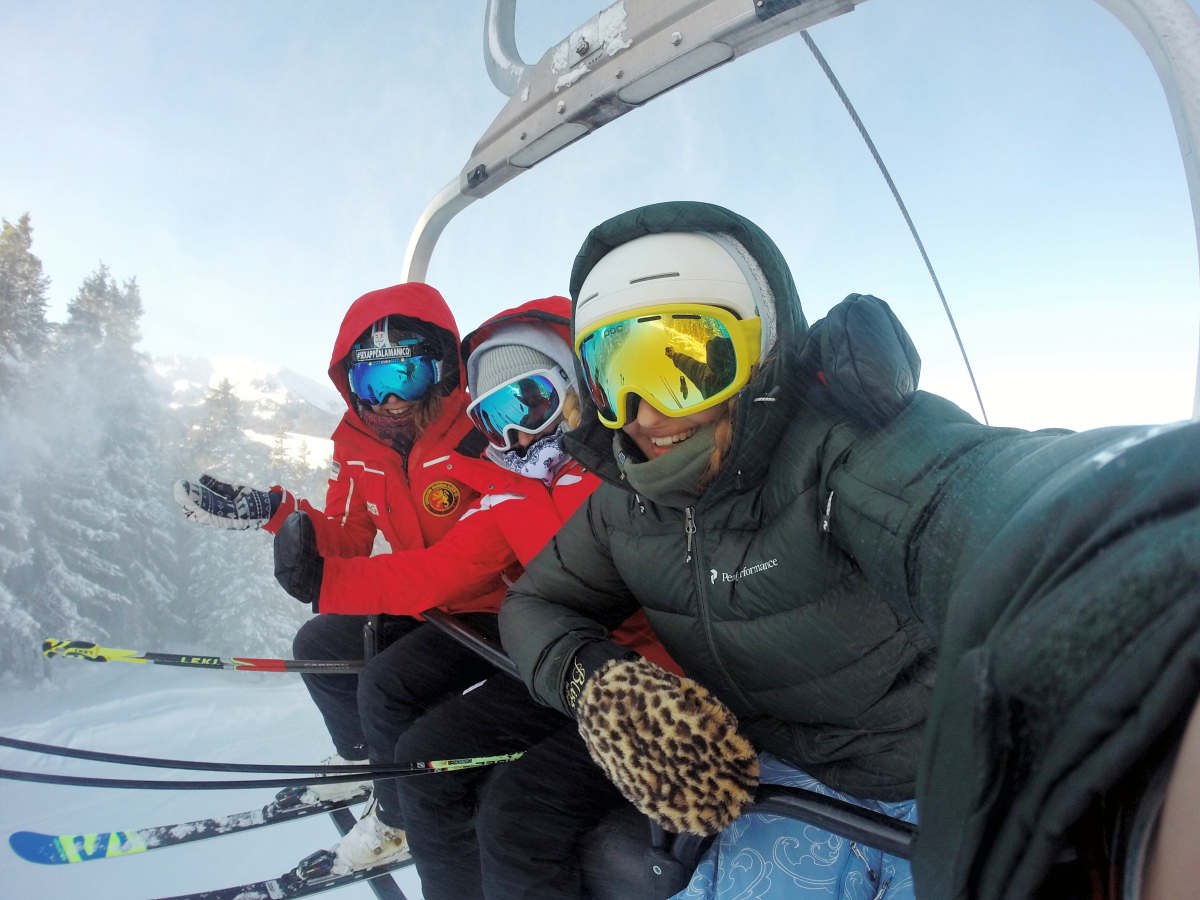 Three person wearing ski gear riding cable car | How to Maintain a Healthy Body