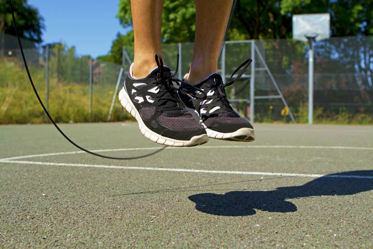 Close male feet jumping mid air | Best Quick Workouts For Busy People Who Don't Have Much Time