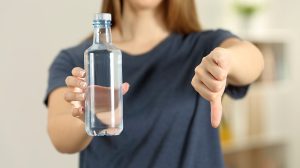 Feature | Holding bottled water and thumbs down | Things They Never Tell You About Bottled Water