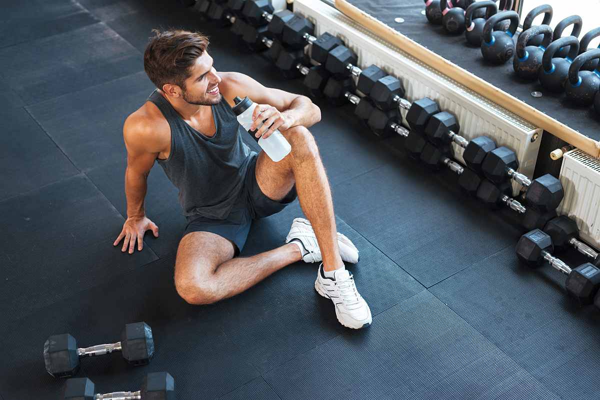 Man holding water container inside the gym | Why Alkaline Water Is Better For Hydration