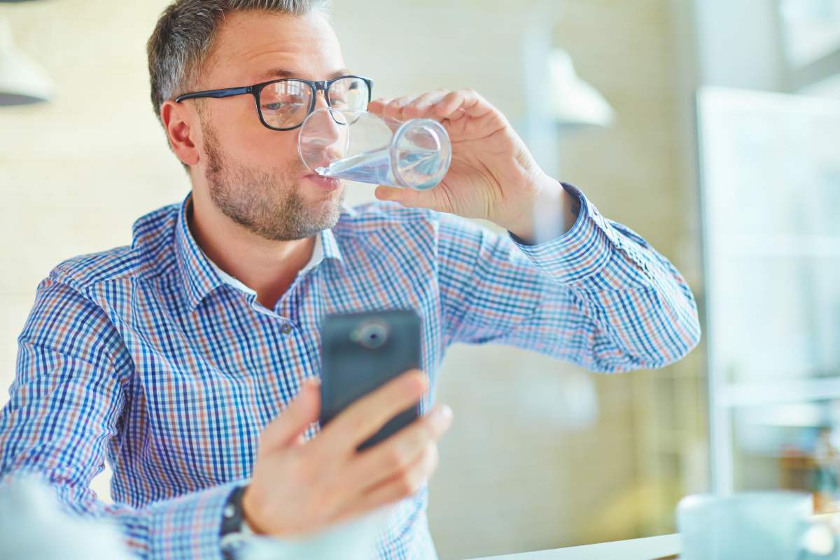 man drinking water | Ways To Restore Your Body’s pH Balance | healthy ph balance