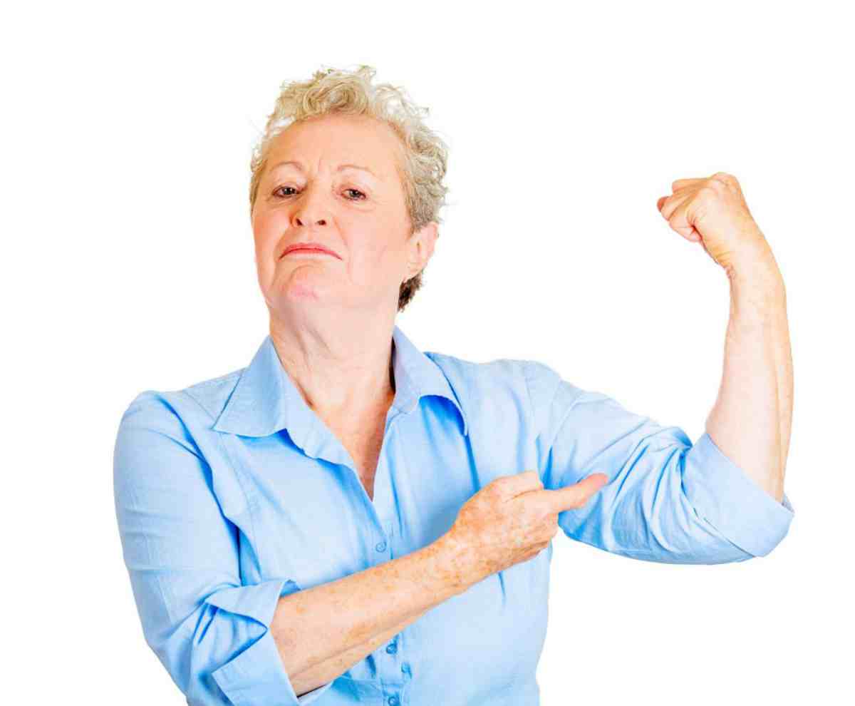 Woman showing her strength | Calcium Benefits: Alkaline Water is a Great Resource!