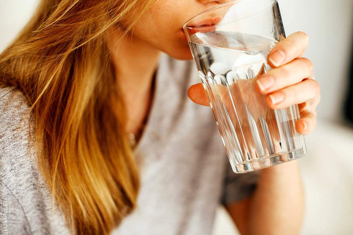 Woman drinking alkaline water | Boost Your Immune System By Drinking Water