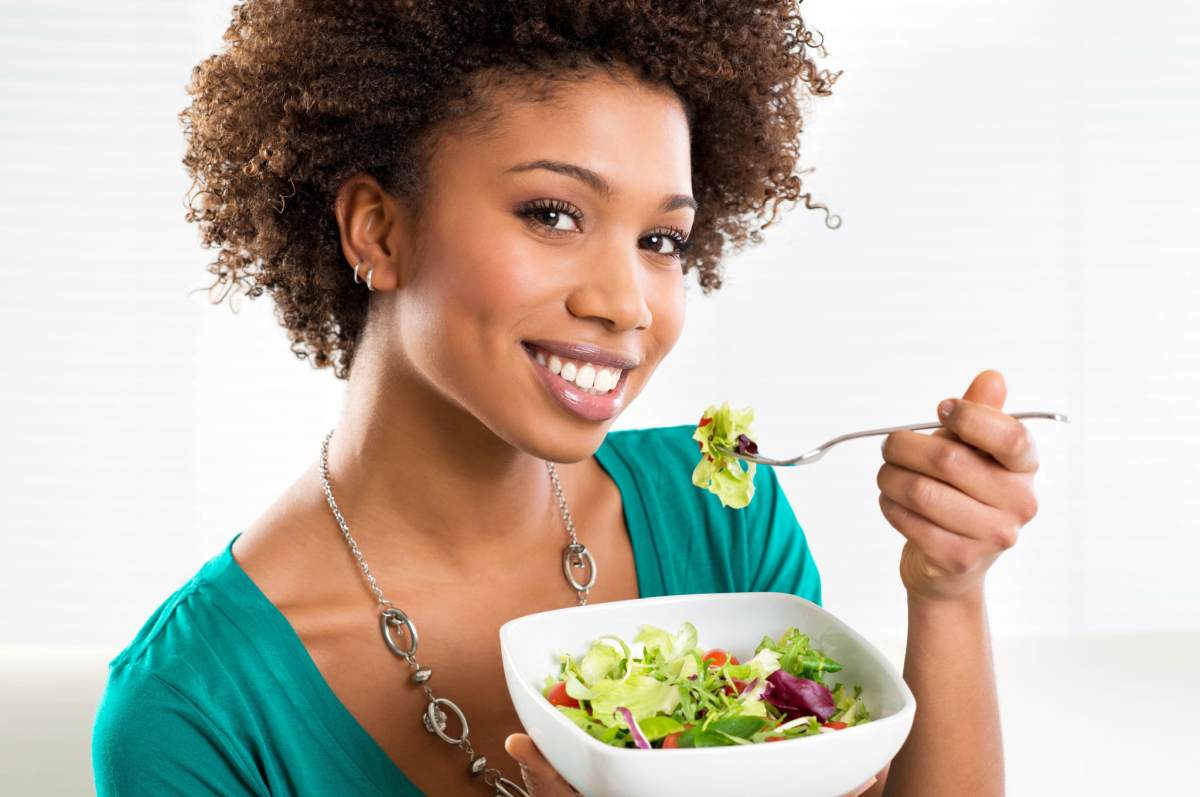 Beautiful African American Woman Eating Salad At Home | Health Tips And Hacks To Live By