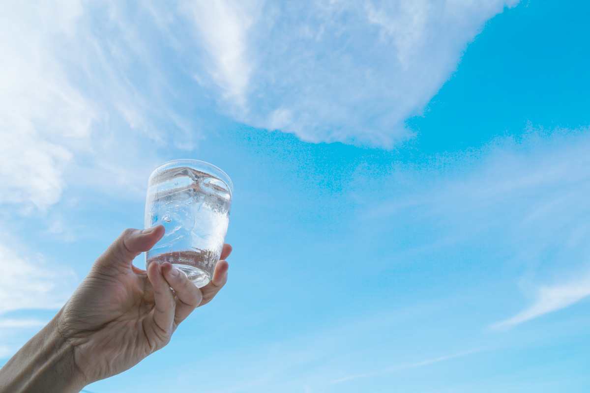 hand raising glass of water | Reasons To Love Tyent Water Ionizers: Health Benefits And More