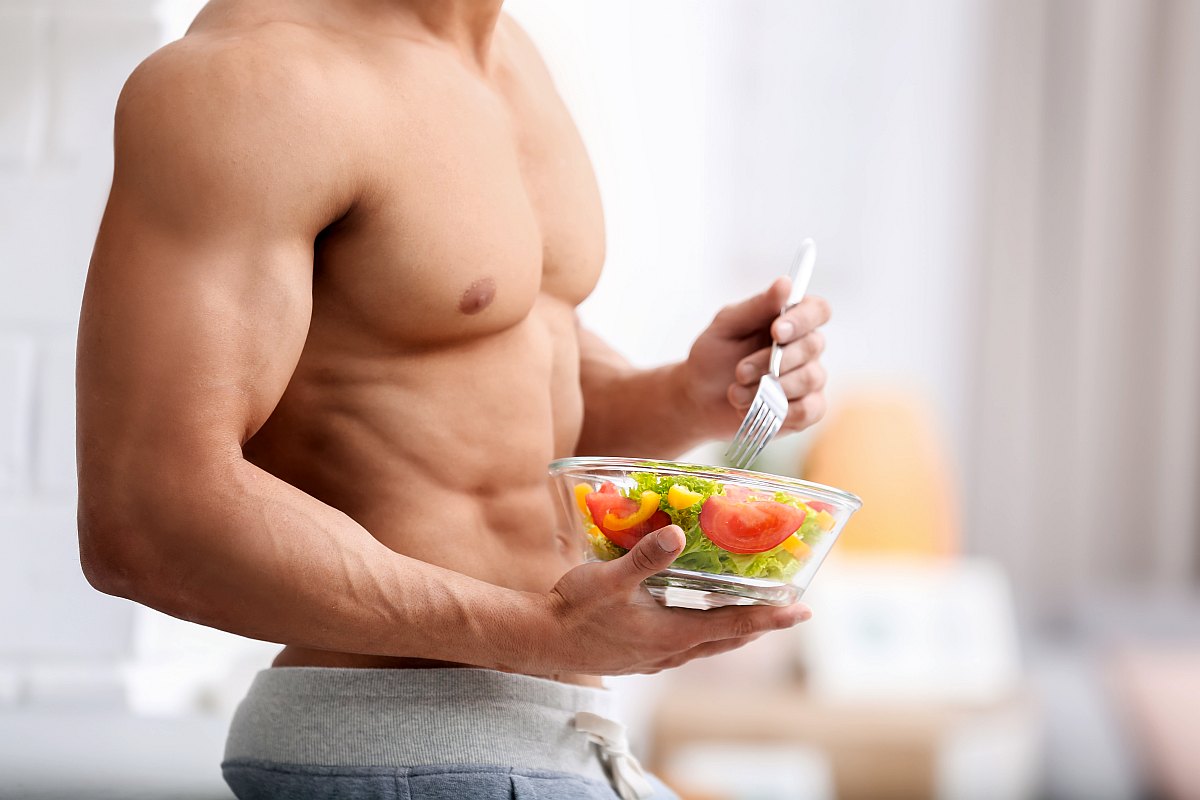 Man holding bowl of vegetable salad | What You Need To Know About The Alkaline Diet