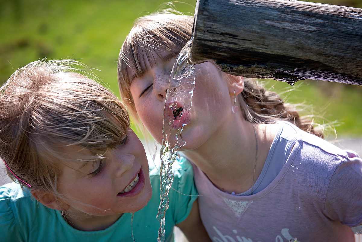 two girls drinking | Types Of Water To Drink
