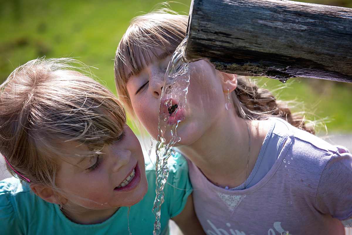 two girls drinking | Types Of Water To Drink 