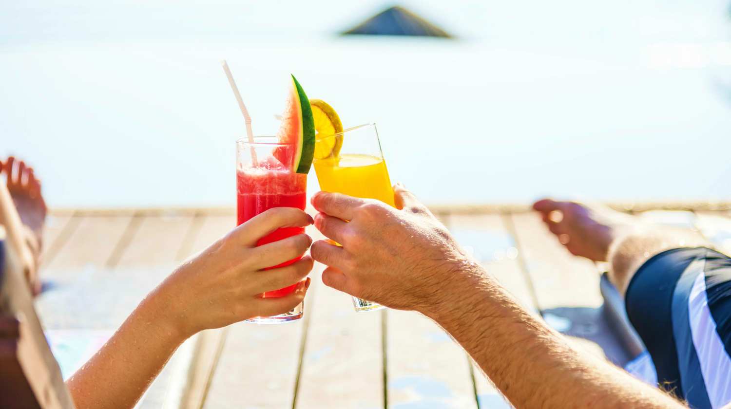 Feature | Man and woman relaxing holding juice | Healthy Juice Recipes You Should Try