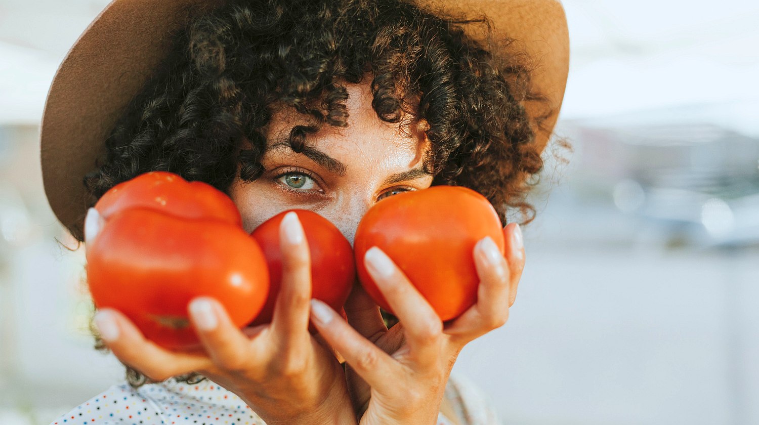 Feature | woman holding fresh tomatoes | Why Should You Wash Fresh Produce with Alkaline Water?