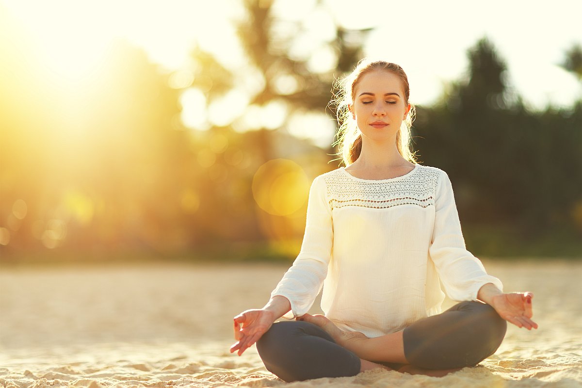 Woman doing yoga outdoor | Health Tips And Hacks To Live By