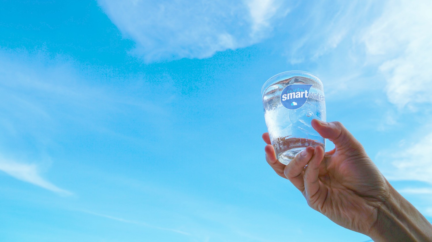 Feature | man holding glass of water | Is Smart Water Safe To Drink? | Smart Water Vs Alkaline Water | smart water electrolytes