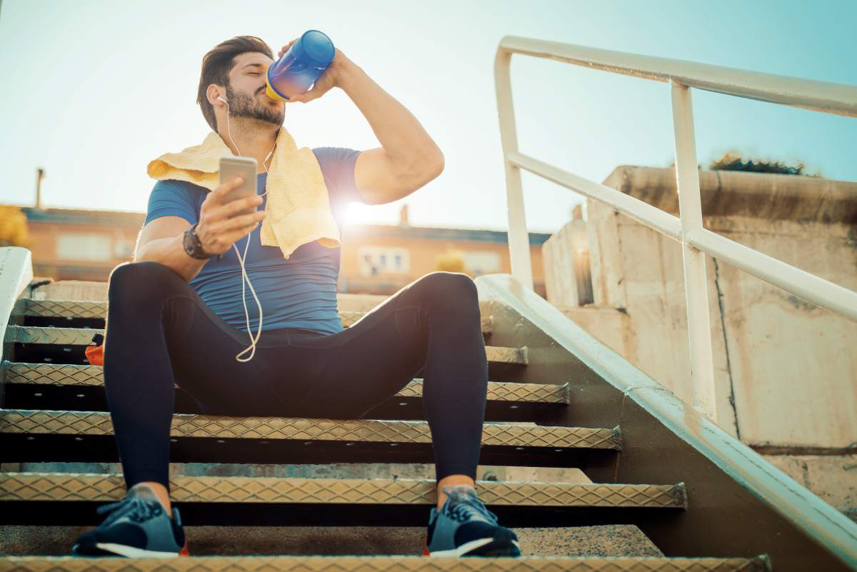 sporty man drinking water | Alkaline Water Benefits For Your Skin, Hair, And Health | alkaline water beauty benefits