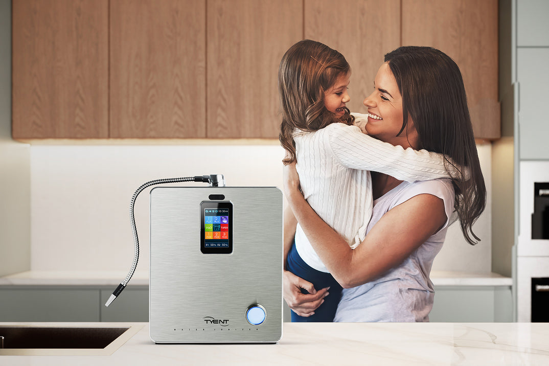 Mother and daughter in kitchen with Tyent water ionizer
