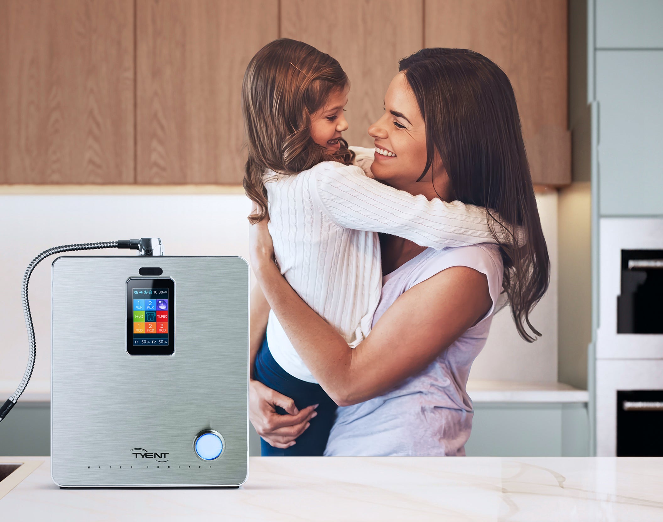 Mother and daughter in kitchen with Tyent water ionizer